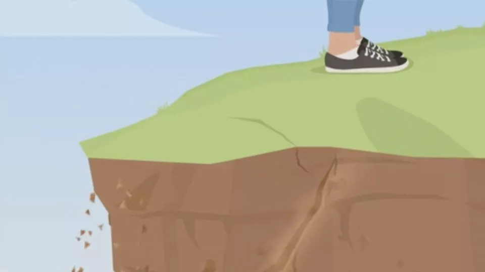 Animated image showing the feet of someone stood on a crumbling cliff edge