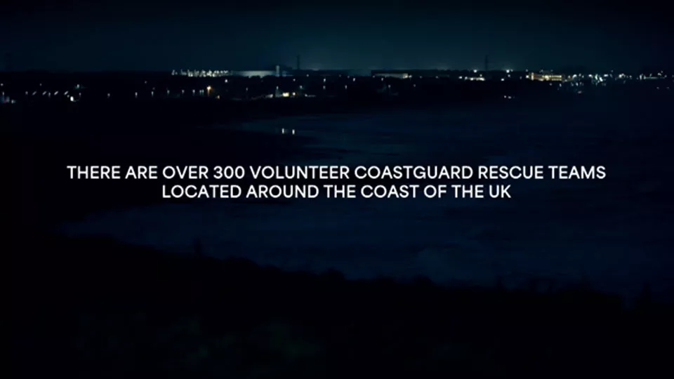 A dark city scene at night overlaid with white text that reads "there are over 300 volunteer coastguard rescue teams located around the coast of the UK"