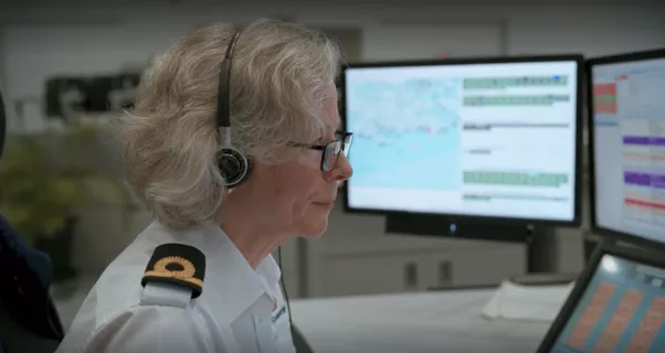 An officer at a computer at the Joint Rescue Coordination Centre in Fareham